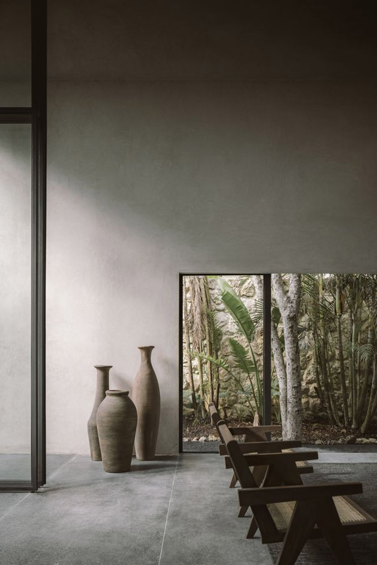 CO-LAB Design Office built concrete villa framing a lush jungle in Tulum