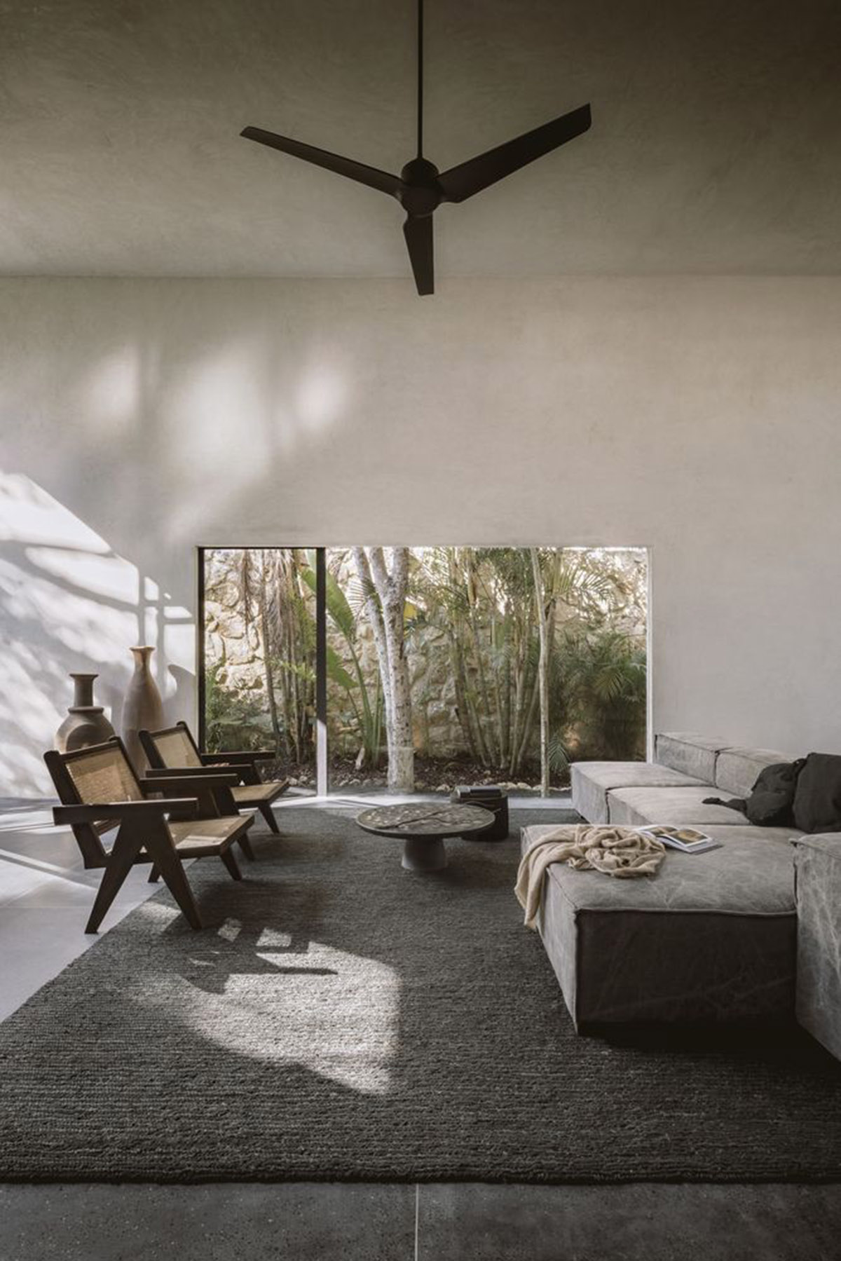 CO-LAB Design Office built concrete villa framing a lush jungle in Tulum
