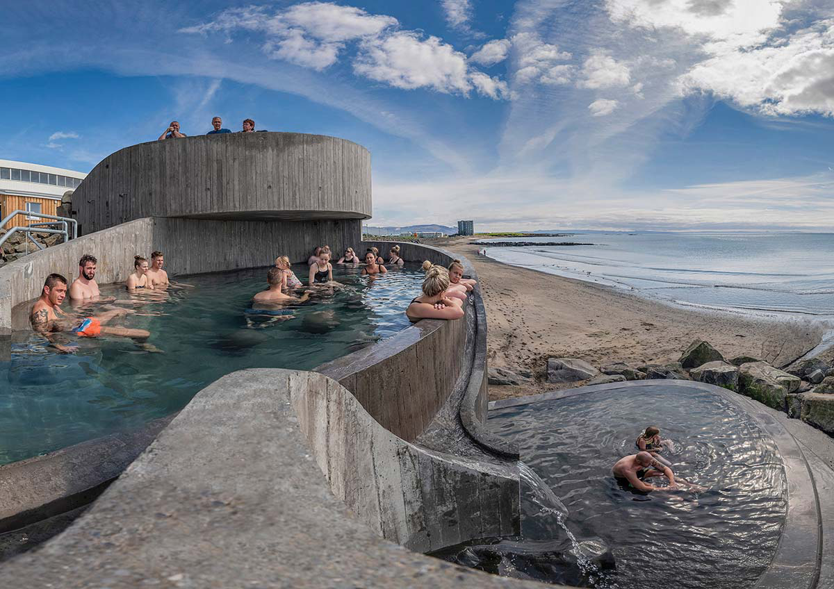Basalt Architects' Guðlaug Baths inspired by little sea pools nestled in rocky barrier in Iceland