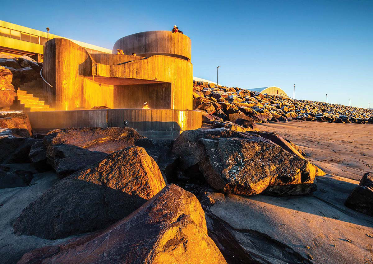 Basalt Architects' Guðlaug Baths inspired by little sea pools nestled in rocky barrier in Iceland