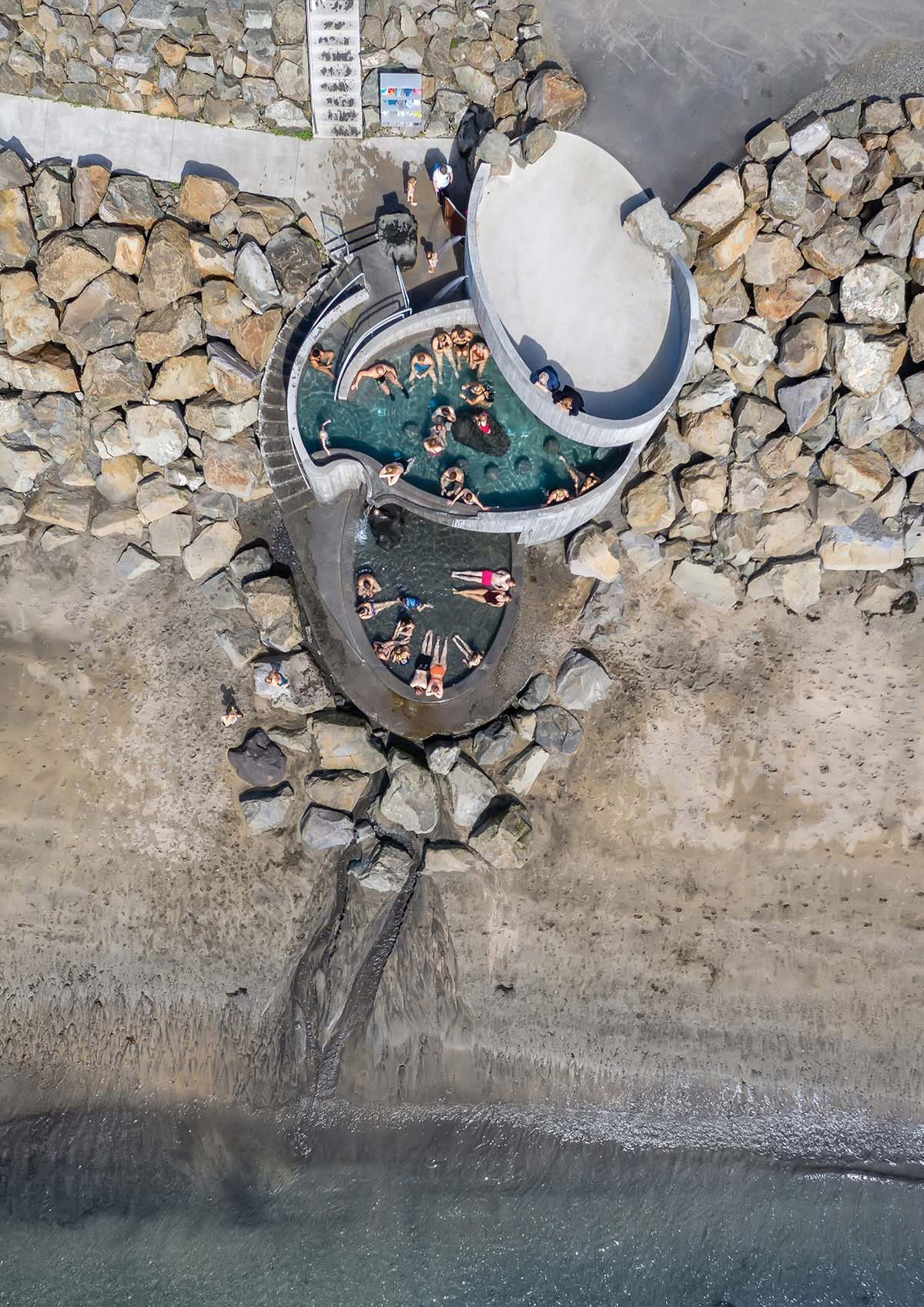 Basalt Architects' Guðlaug Baths inspired by little sea pools nestled in rocky barrier in Iceland