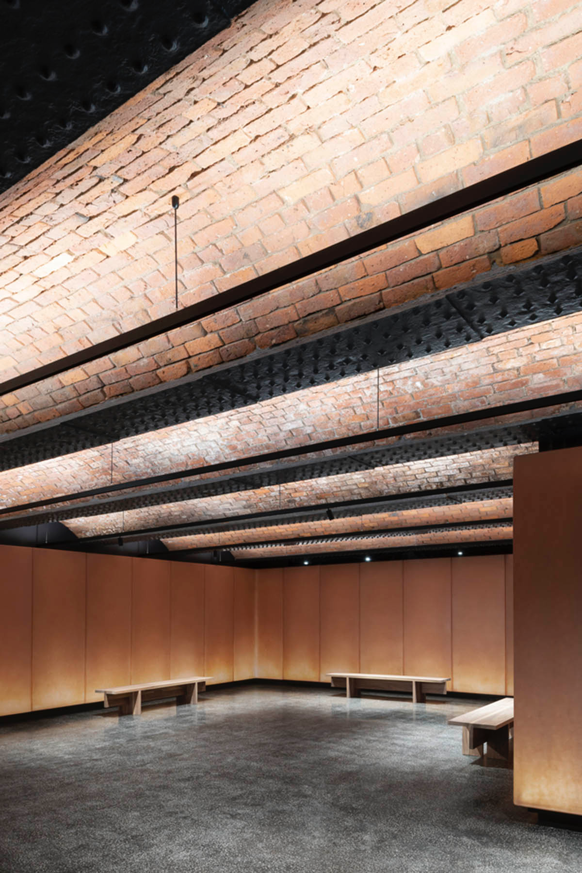 Carmody Groarke completes gallery that features brick vaulted ceilings and back-lit panels