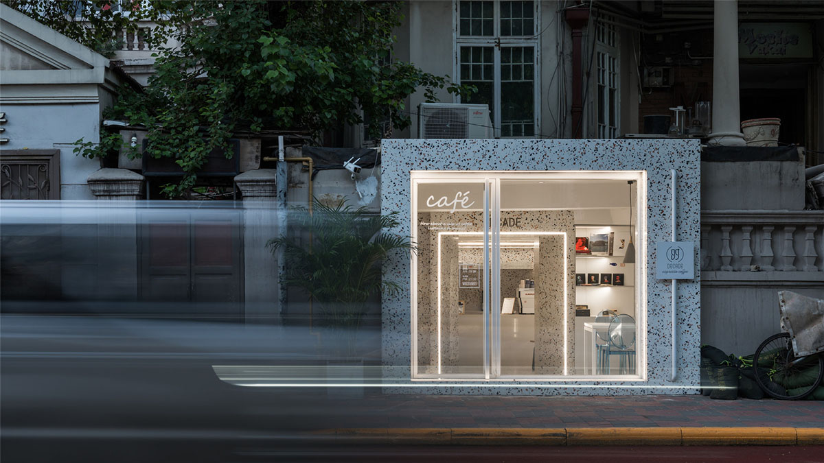 This tiny cafe by TOUCH Design is dotted with white and orange interwoven terrazzo details in Tianjin