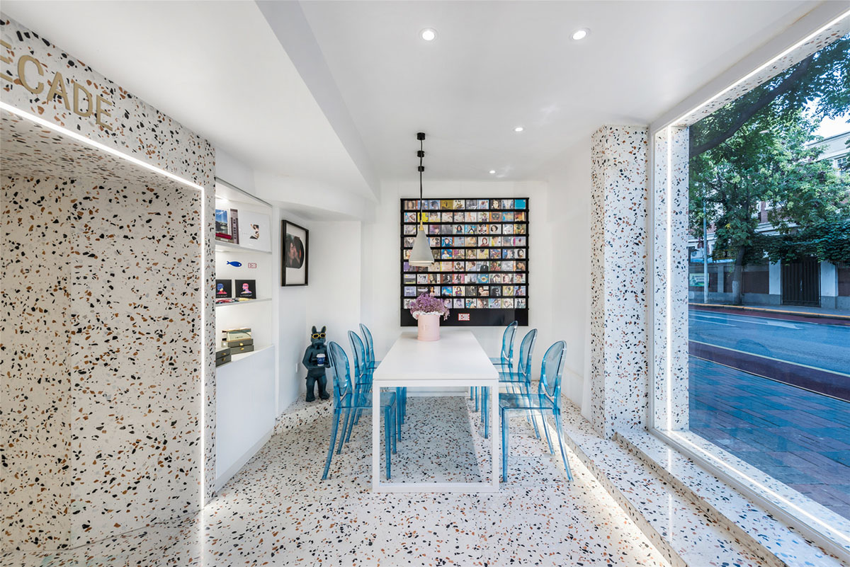 This tiny cafe by TOUCH Design is dotted with white and orange interwoven terrazzo details in Tianjin