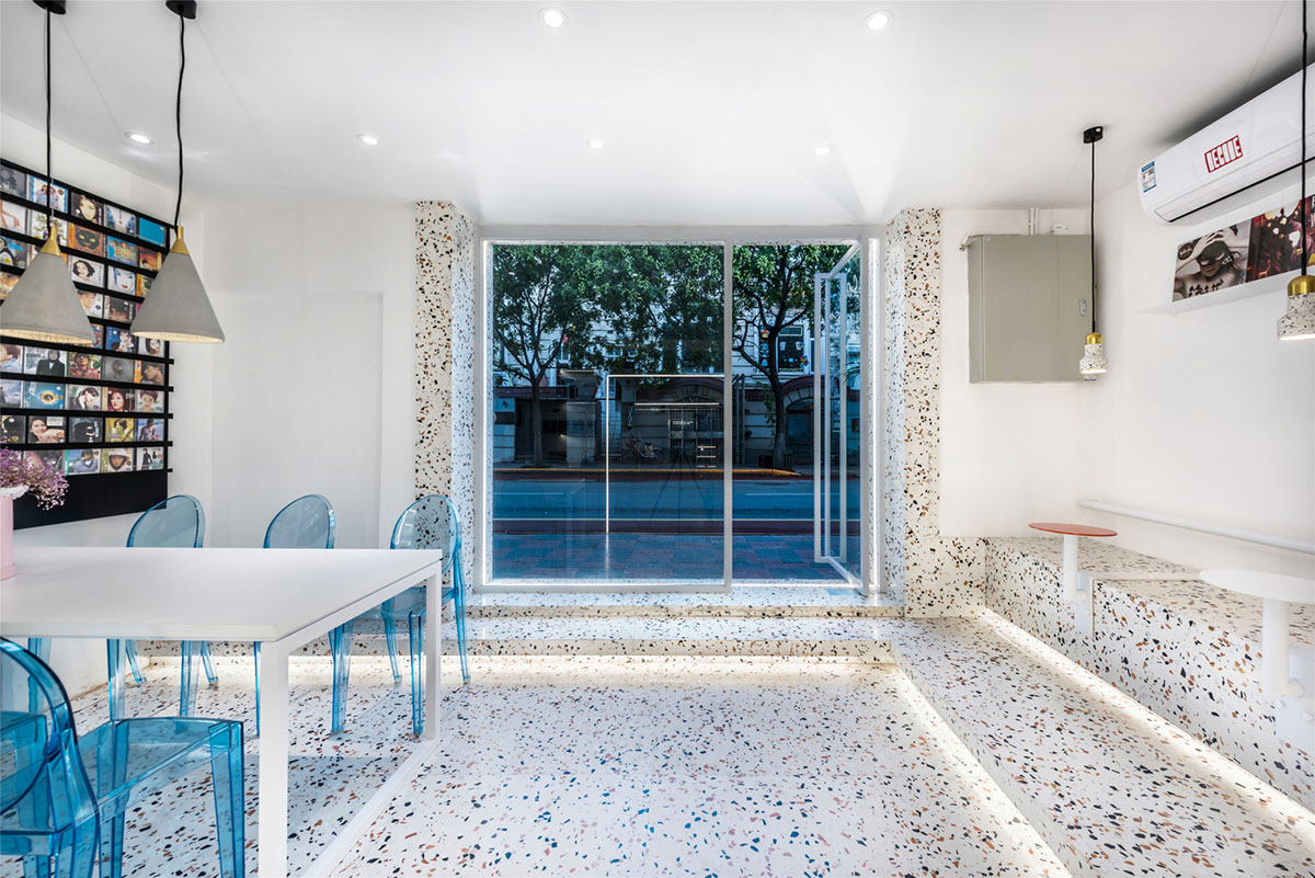 This tiny cafe by TOUCH Design is dotted with white and orange interwoven terrazzo details in Tianjin