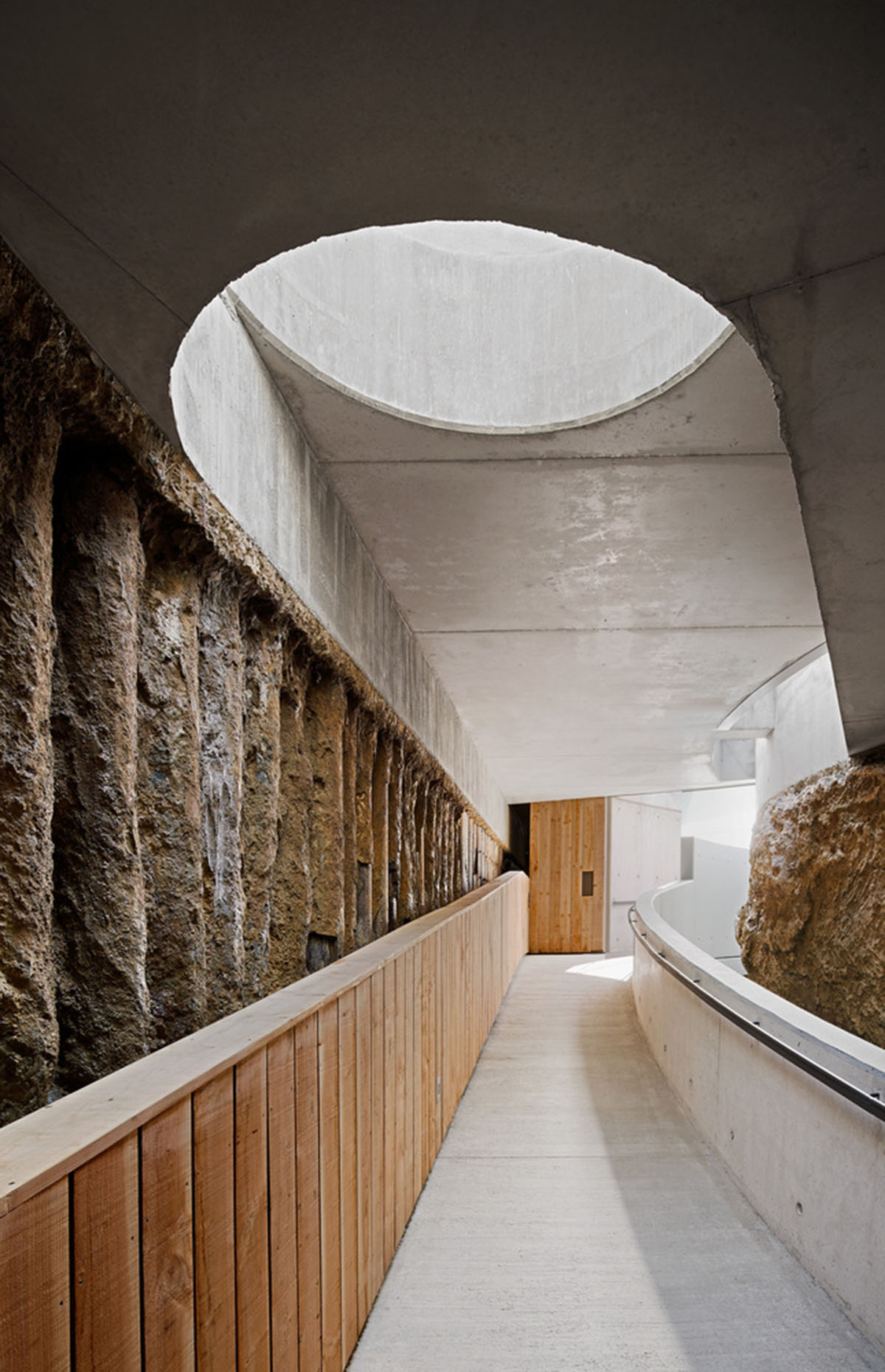 Aigua de Vilaju&iuml;ga restored with vaulted bricks and exposed concrete bringing light into the space