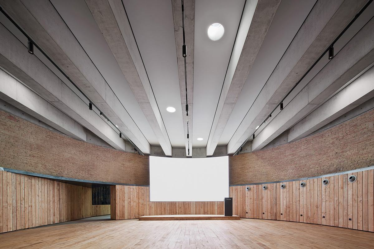 Aigua de Vilaju&iuml;ga restored with vaulted bricks and exposed concrete bringing light into the space