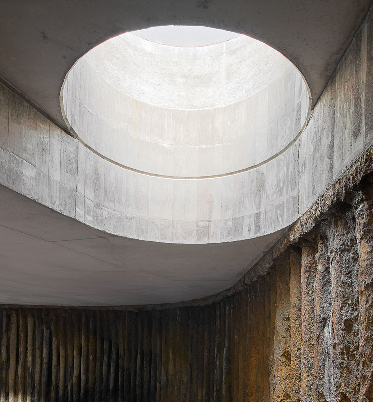 Aigua de Vilaju&iuml;ga restored with vaulted bricks and exposed concrete bringing light into the space
