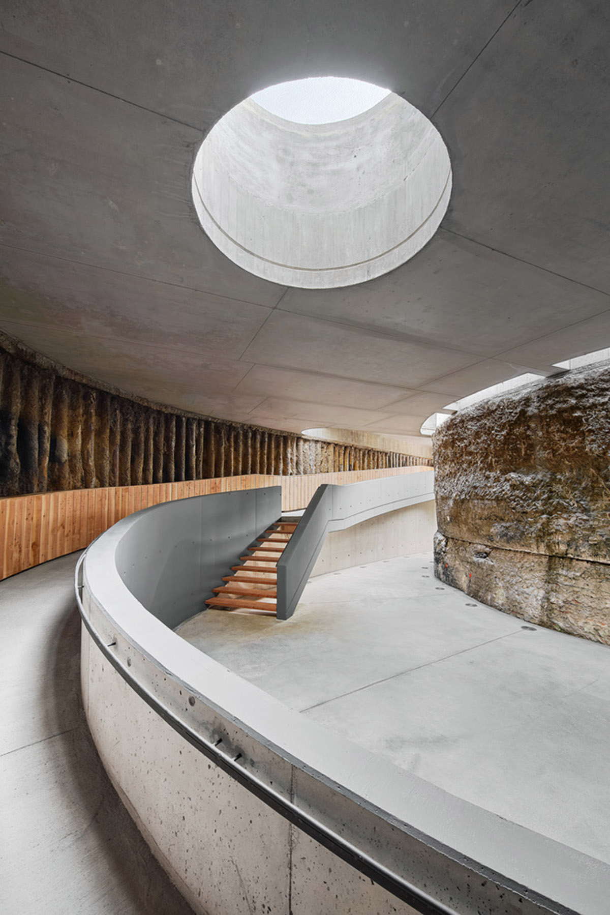 Aigua de Vilaju&iuml;ga restored with vaulted bricks and exposed concrete bringing light into the space