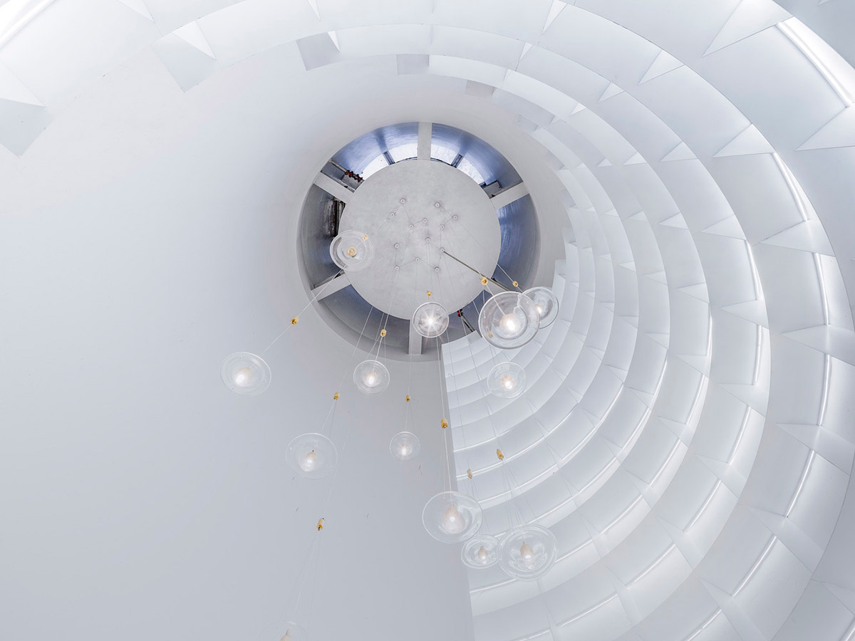 Ten towering cylindrical cement silos are converted to house immersive library of books in China