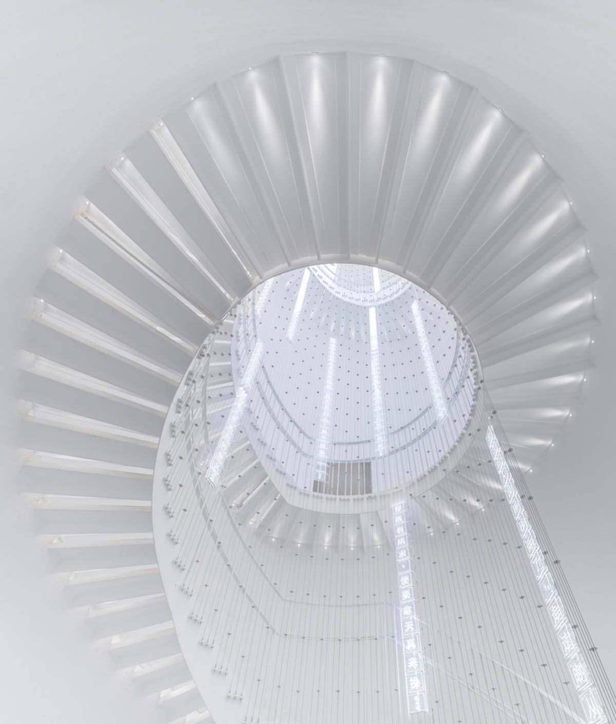 Ten towering cylindrical cement silos are converted to house immersive library of books in China