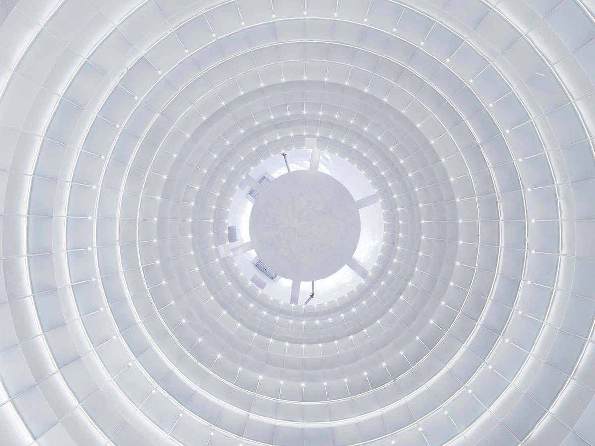 Ten towering cylindrical cement silos are converted to house immersive library of books in China