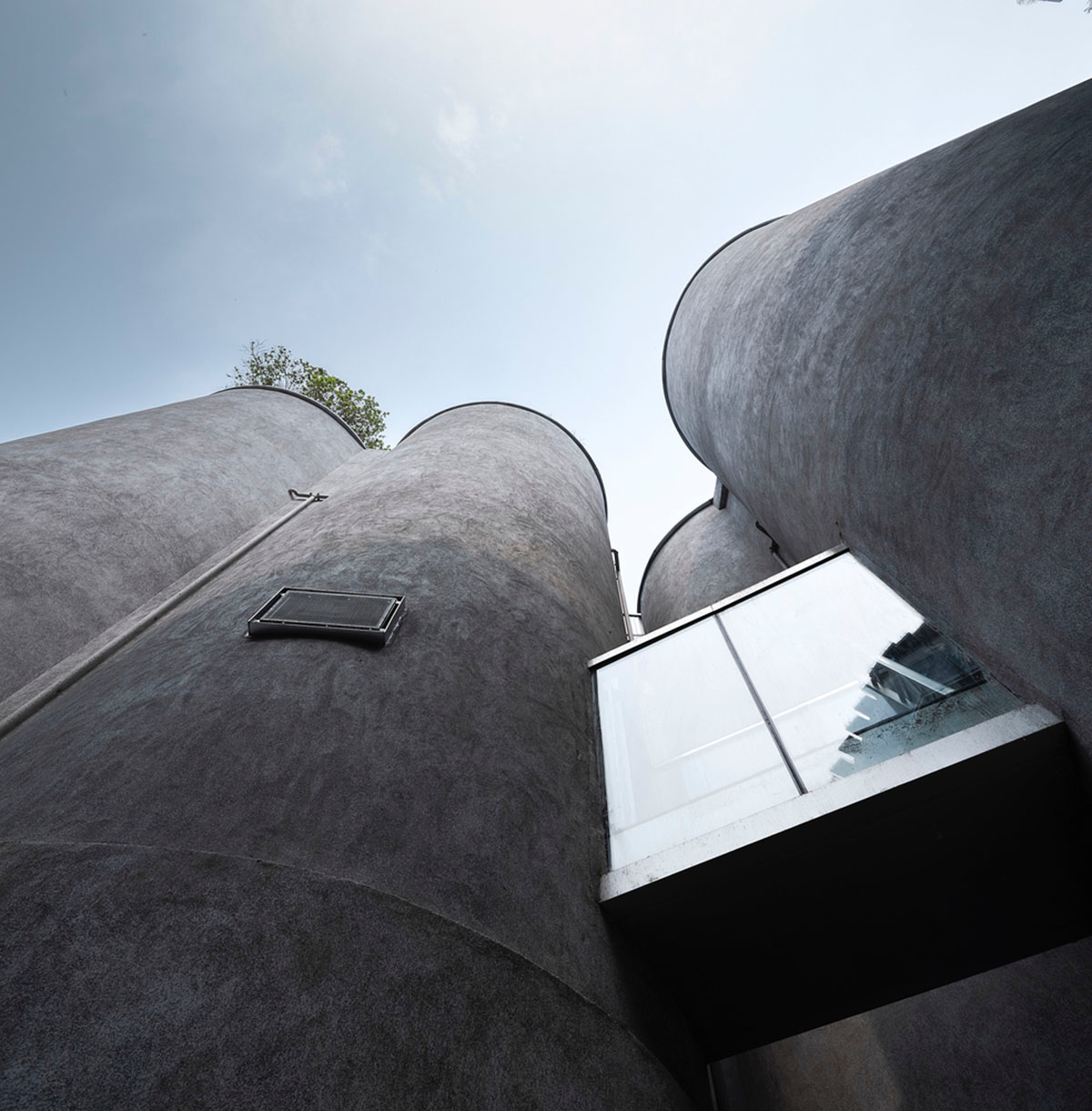 Ten towering cylindrical cement silos are converted to house immersive library of books in China