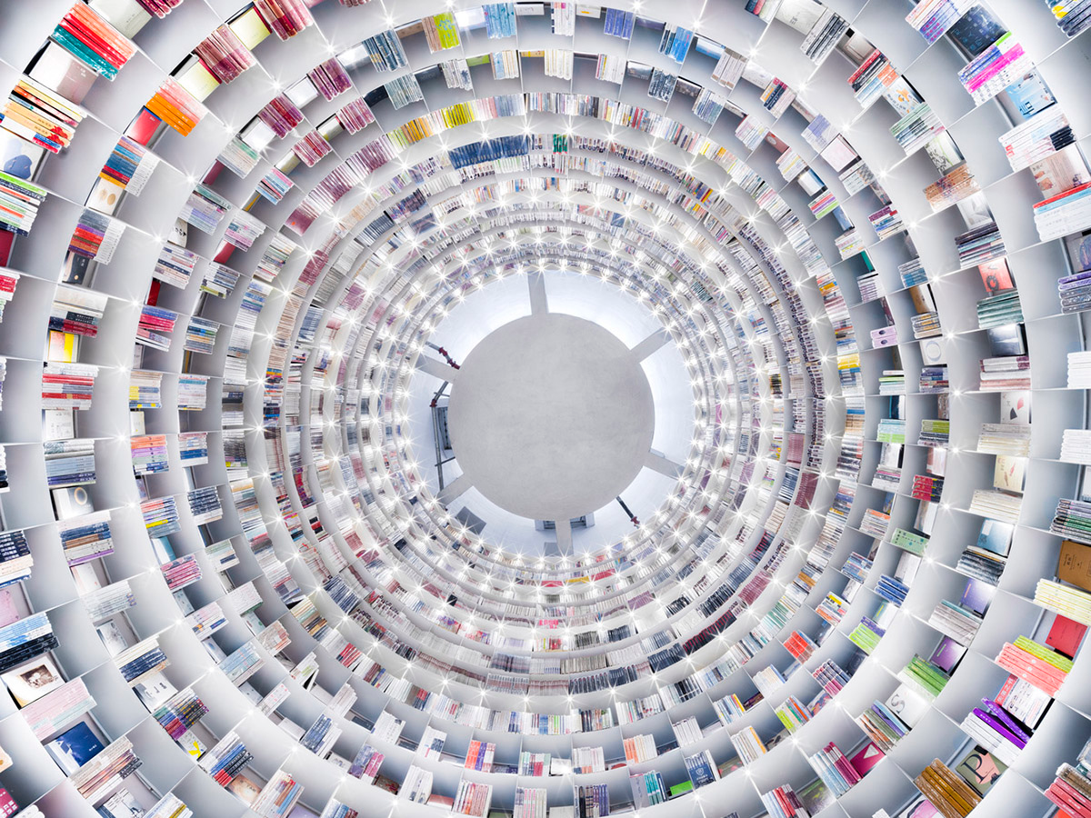 Ten towering cylindrical cement silos are converted to house immersive library of books in China