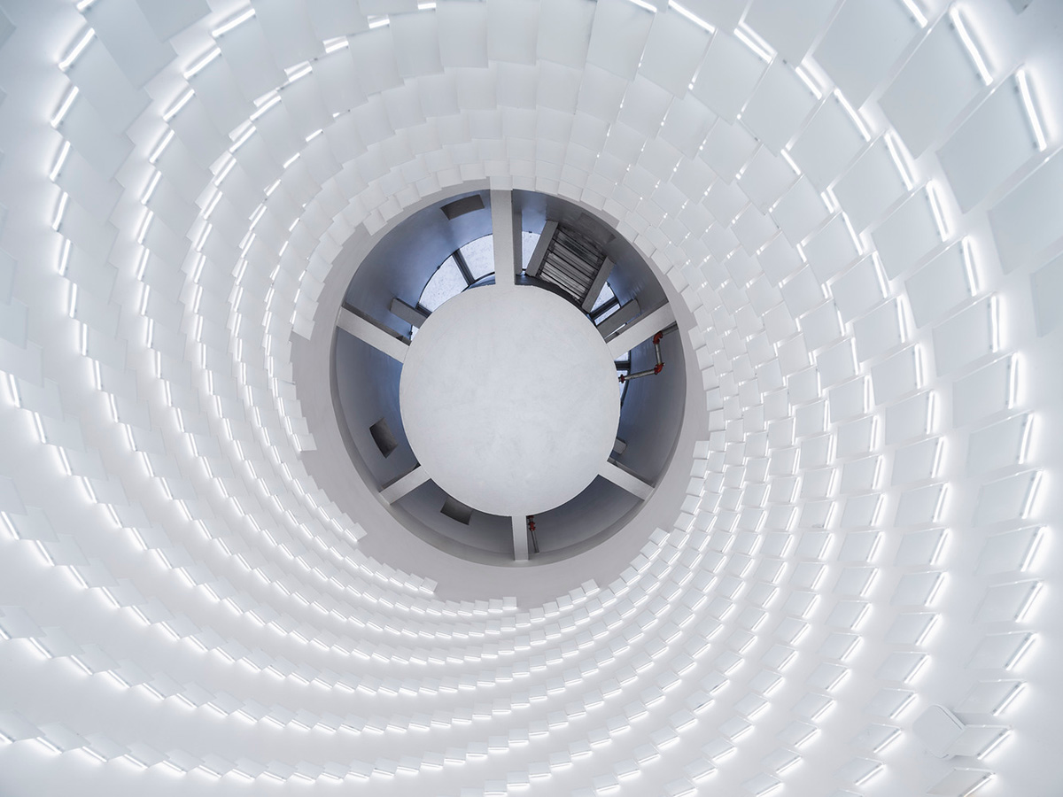 Ten towering cylindrical cement silos are converted to house immersive library of books in China
