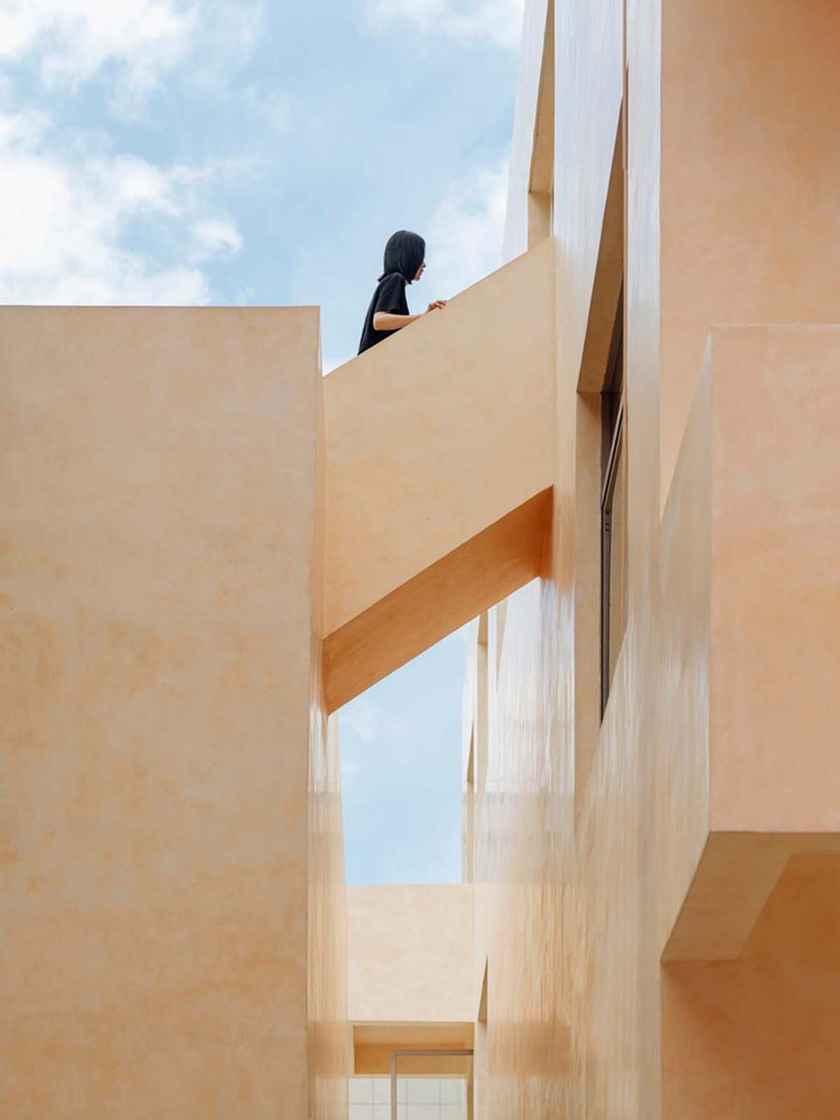 Ladder-Like sandalwood yellow volumes form Buddha artist's exhibition space and studio in China