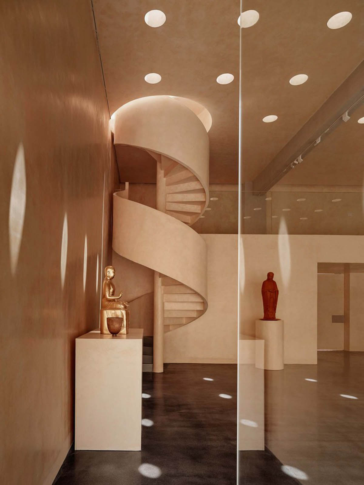 Ladder-Like sandalwood yellow volumes form Buddha artist's exhibition space and studio in China