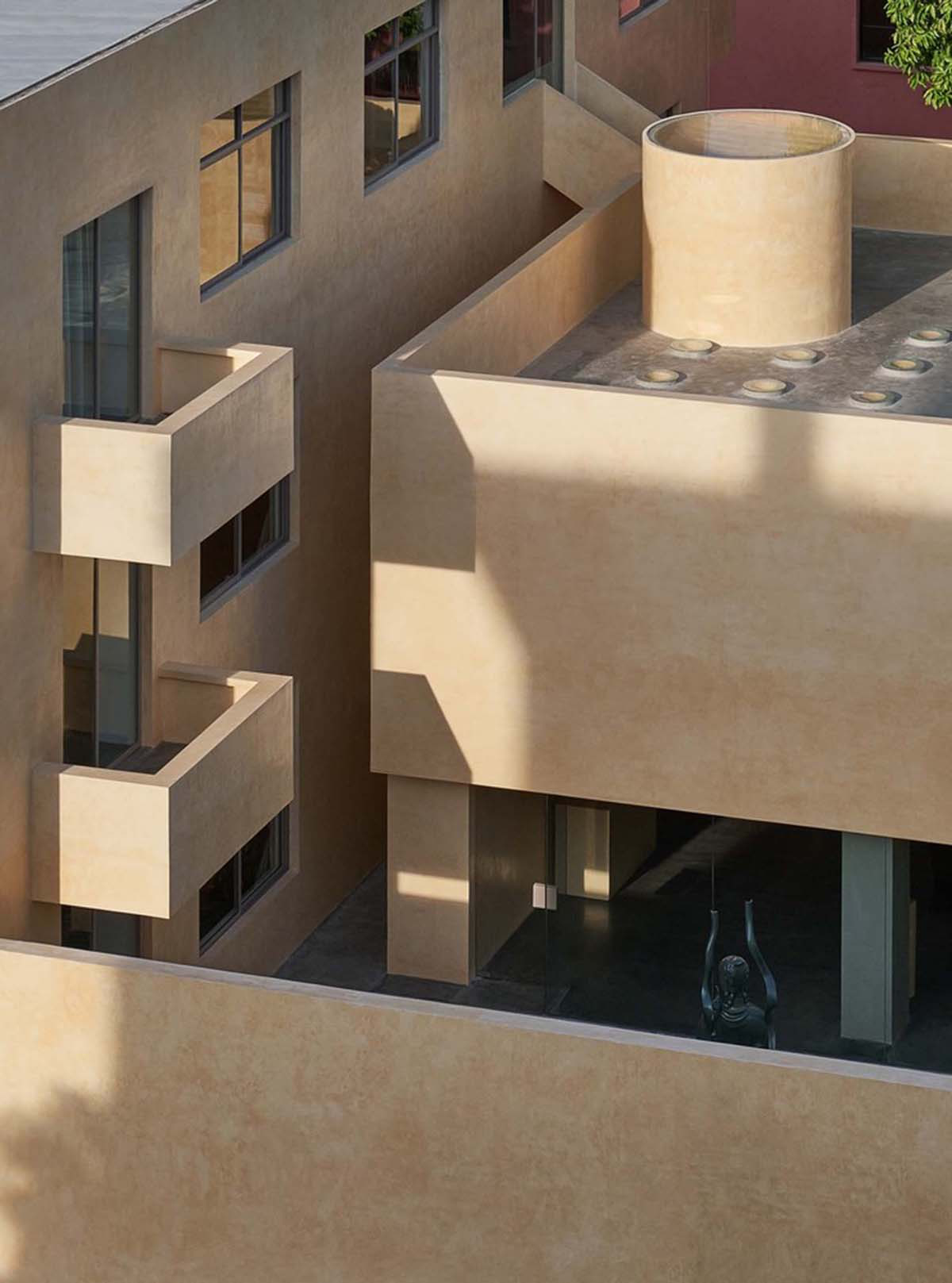 Ladder-Like sandalwood yellow volumes form Buddha artist's exhibition space and studio in China