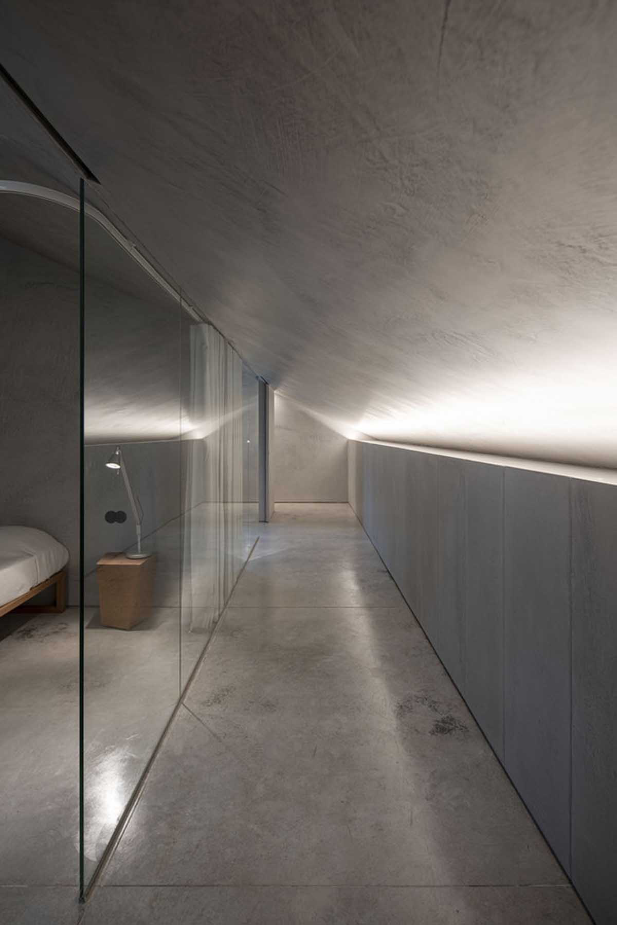 Carvalho Ara&uacute;jo designed singular concrete volume overlooking a lush forest in Portugal