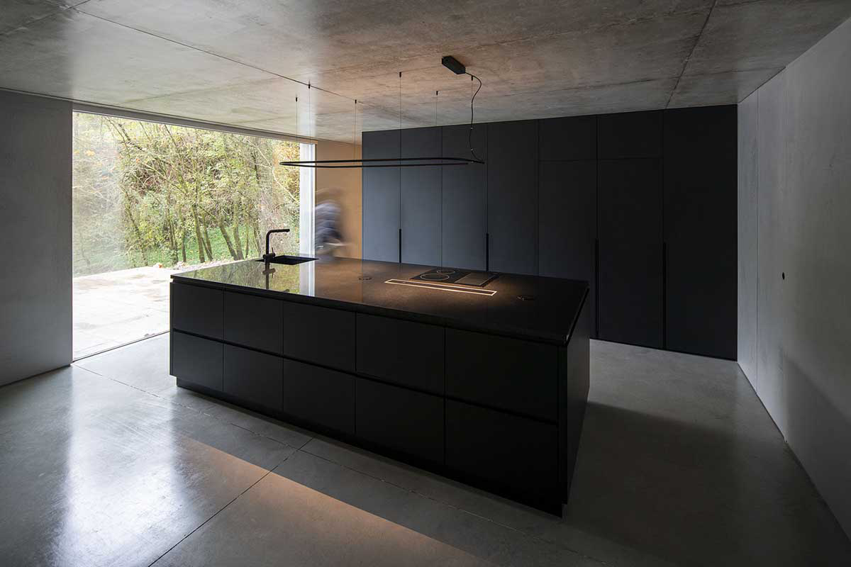 Carvalho Ara&uacute;jo designed singular concrete volume overlooking a lush forest in Portugal