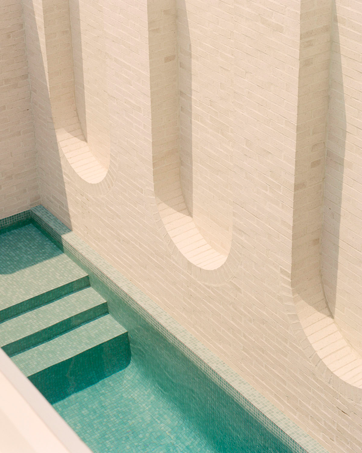 Studio Bright extends Ruckers Hill House with inverted Roman aqueduct in Northcote