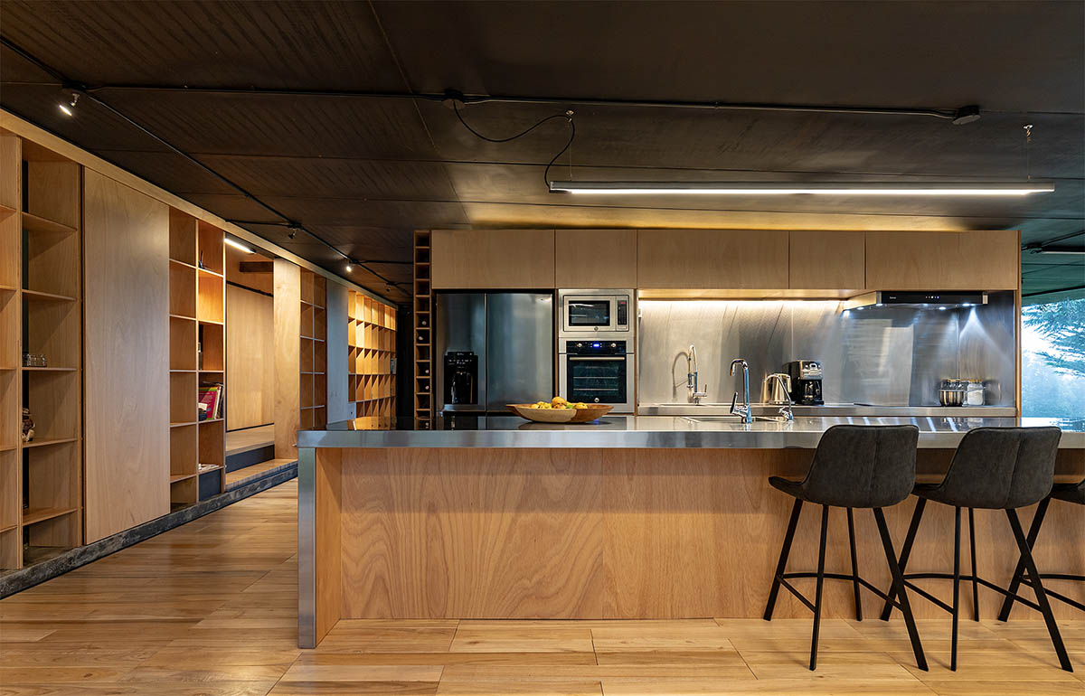 RAMA estudio built glazed retreat that sits on slope with minimal touch overlooking valley in Ecuador