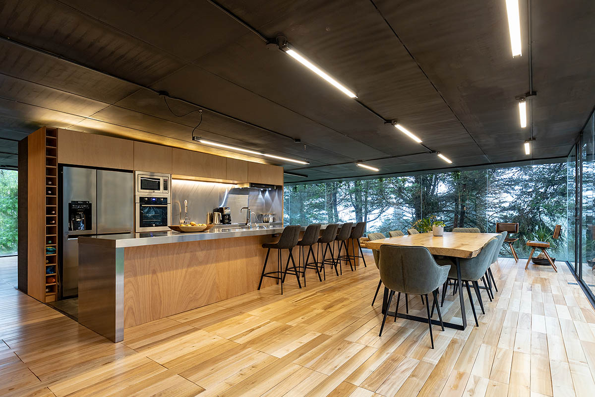 RAMA estudio built glazed retreat that sits on slope with minimal touch overlooking valley in Ecuador