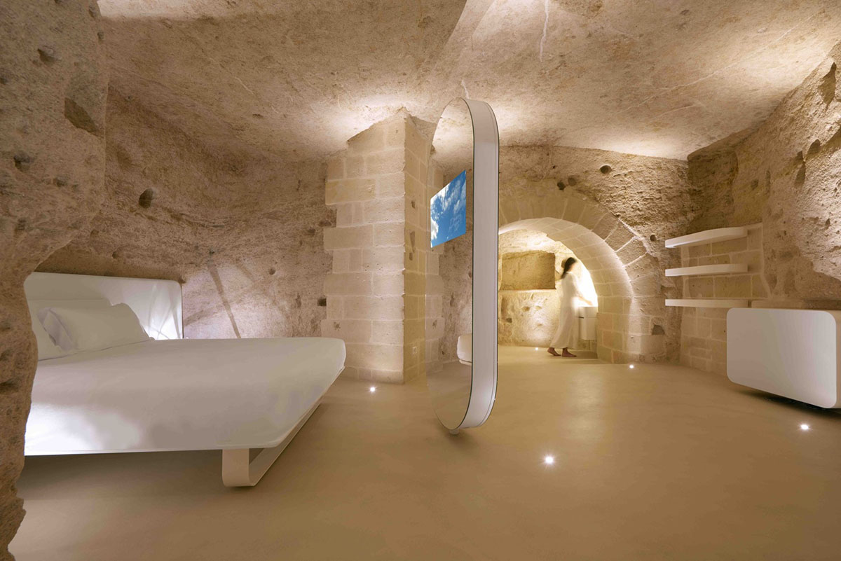 Interiors of this cave hotel and spa by Simone Micheli act like work of art with excavated surfaces