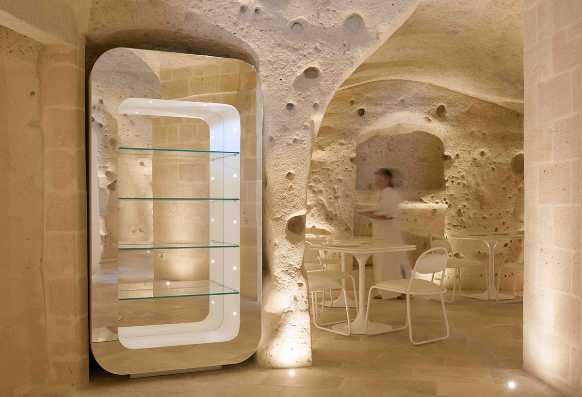 Interiors of this cave hotel and spa by Simone Micheli act like work of art with excavated surfaces