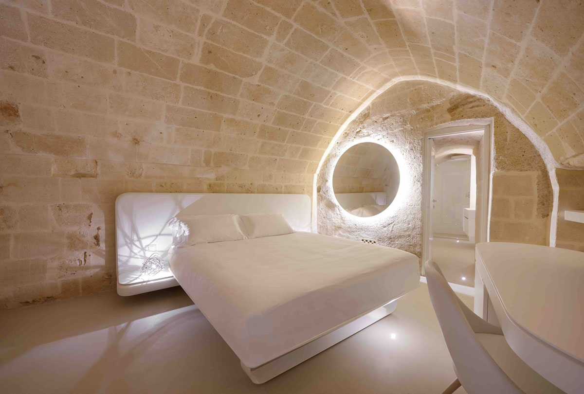 Interiors of this cave hotel and spa by Simone Micheli act like work of art with excavated surfaces