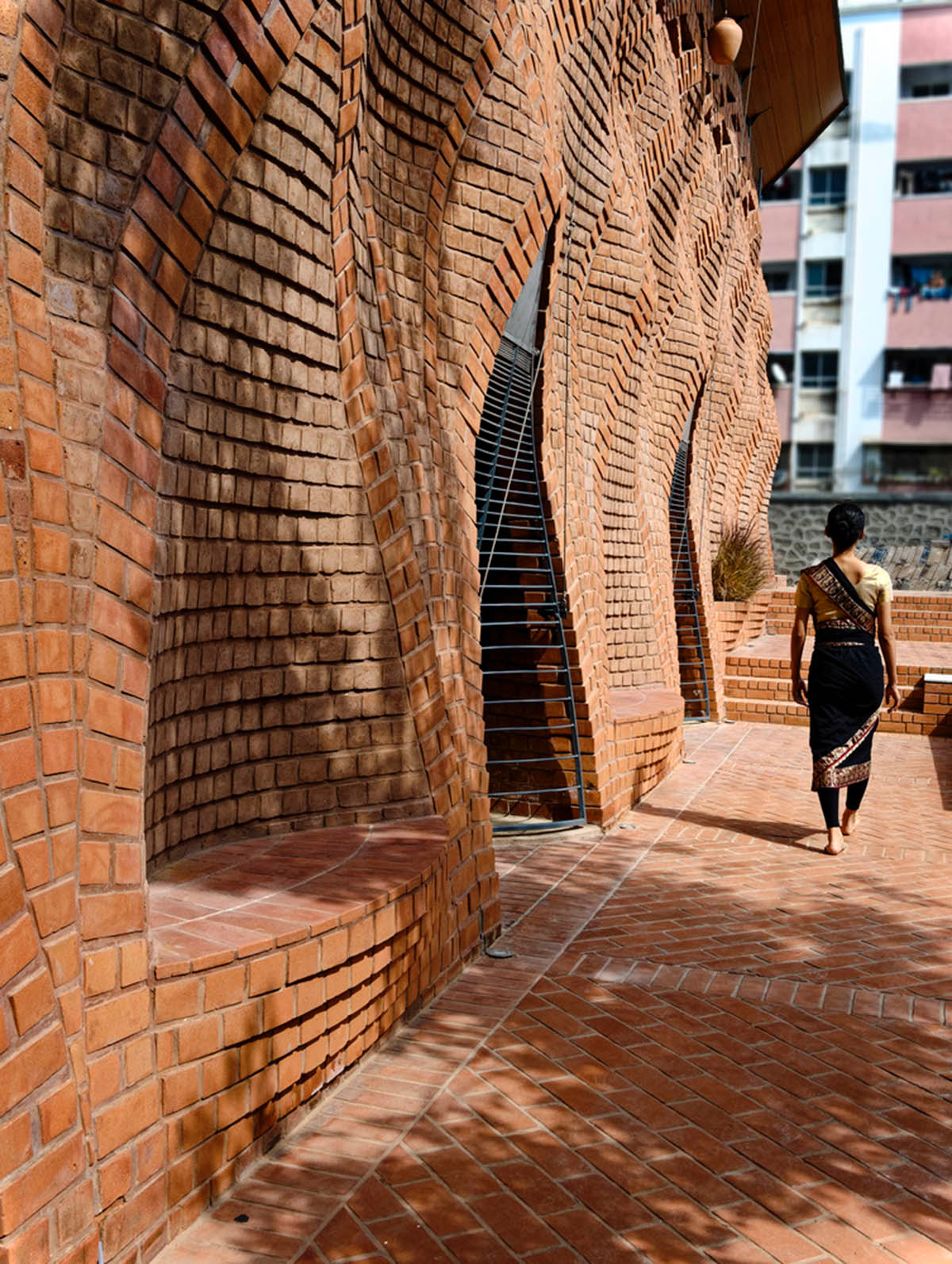 PMA madhushala's community center features undulating and artistic brick walls in Pune