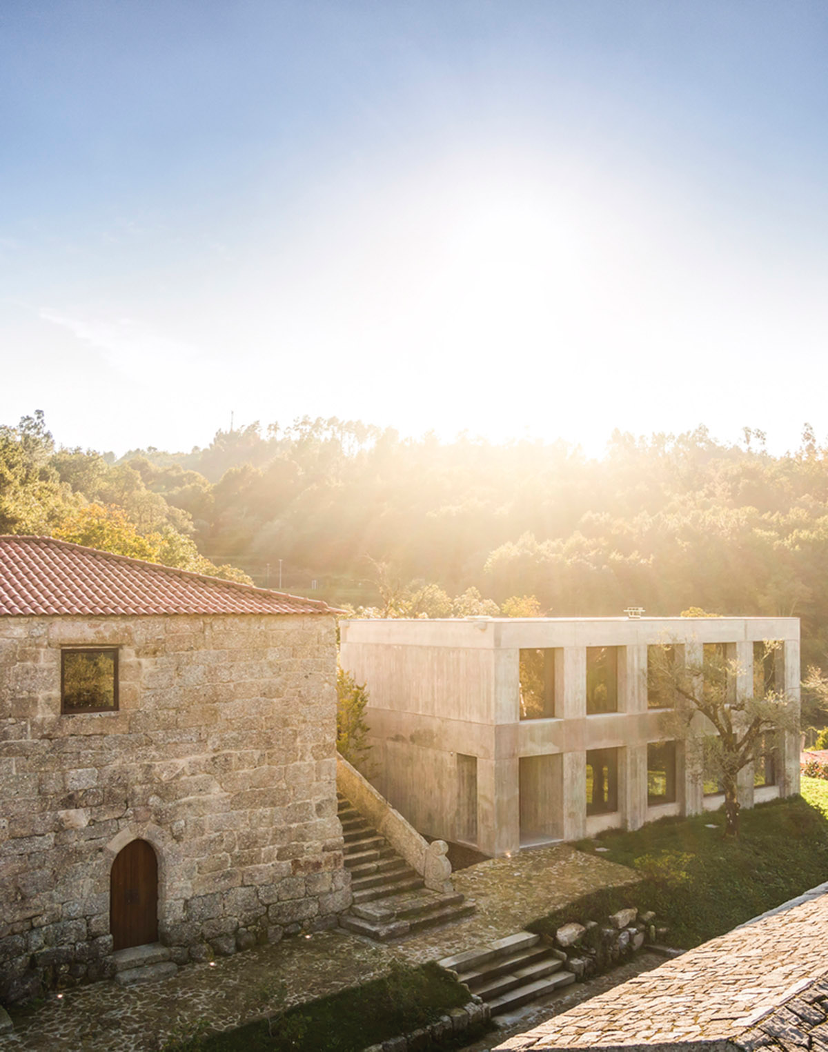 Concrete house by Germano de Castro Pinheiro Arquitectos creates pure balance between old and new