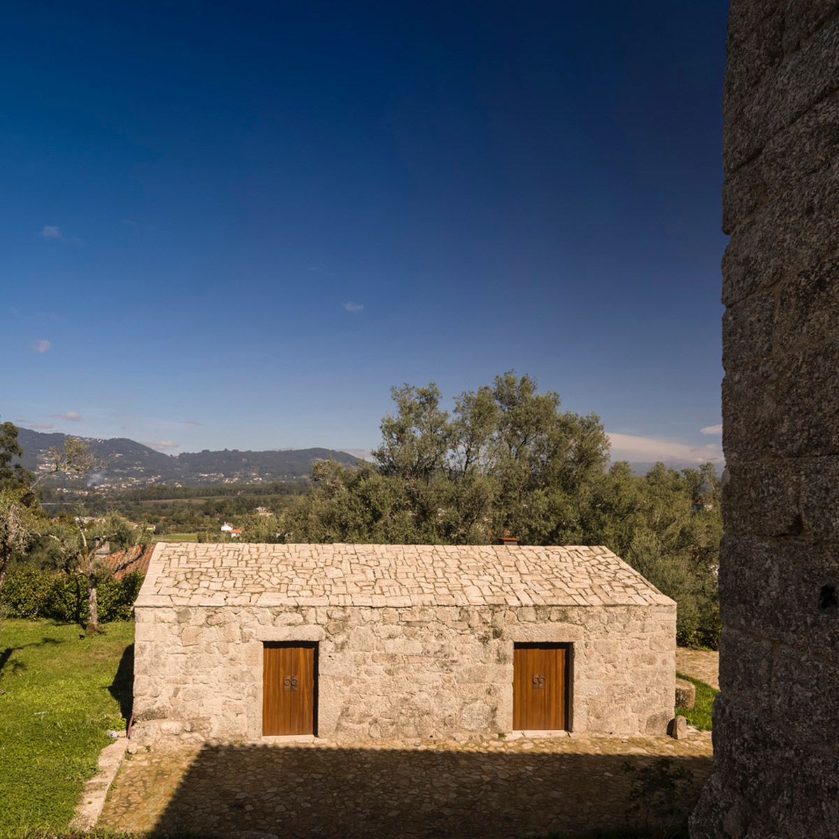 Concrete house by Germano de Castro Pinheiro Arquitectos creates pure balance between old and new