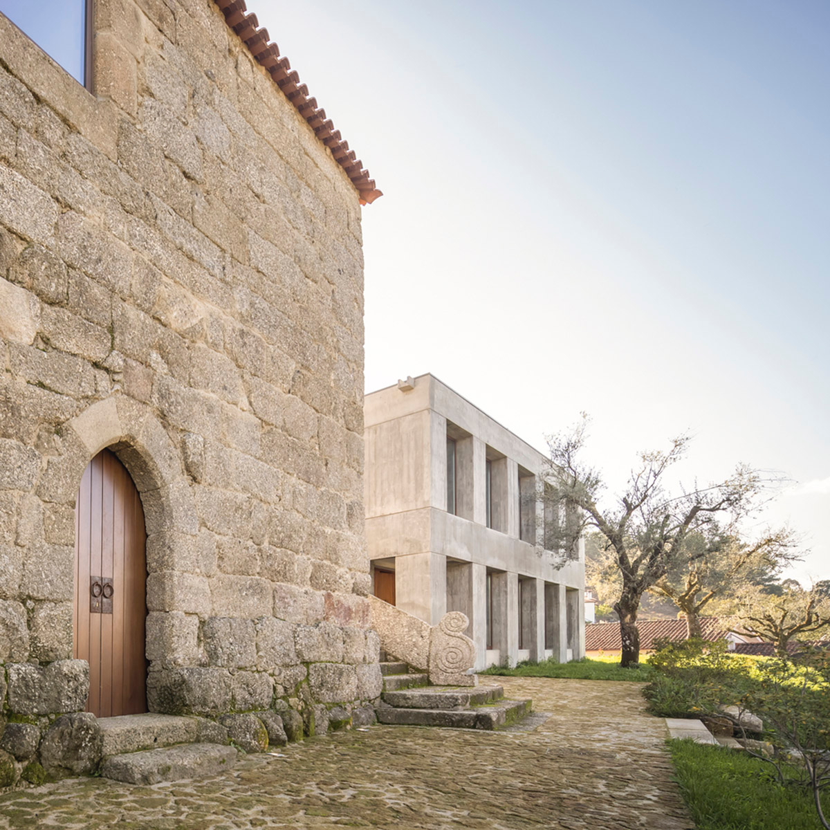 Concrete house by Germano de Castro Pinheiro Arquitectos creates pure balance between old and new