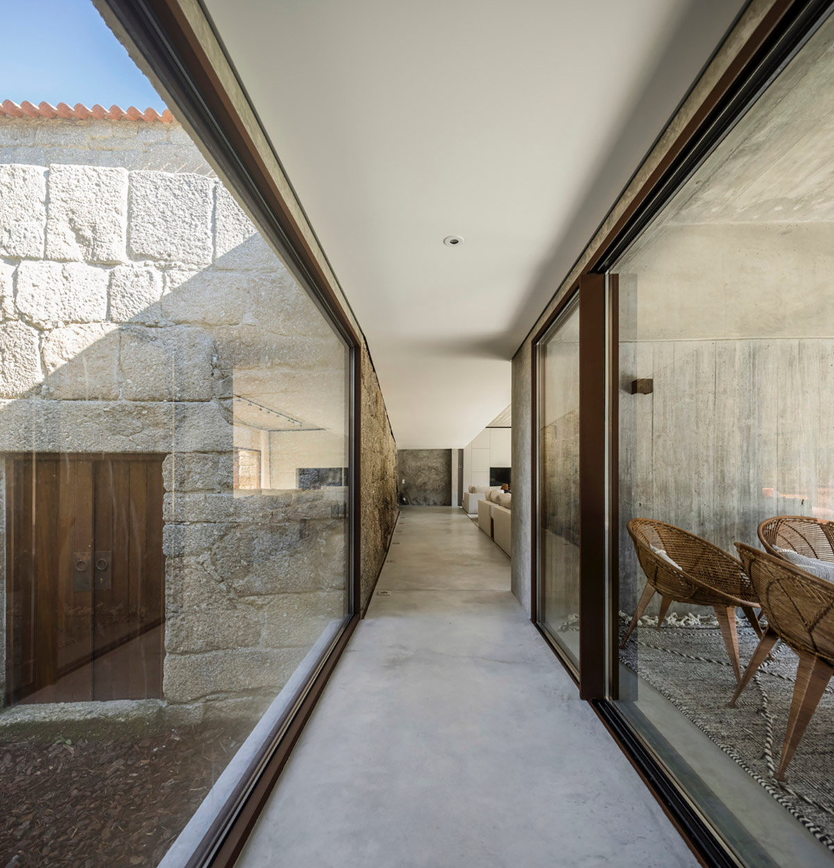 Concrete house by Germano de Castro Pinheiro Arquitectos creates pure balance between old and new