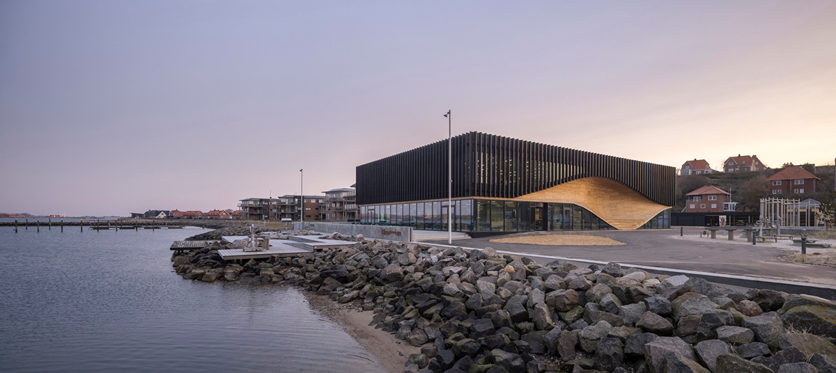 3XN Architects and SLA Architects complete Klimatorium featuring wooden wave in Denmark
