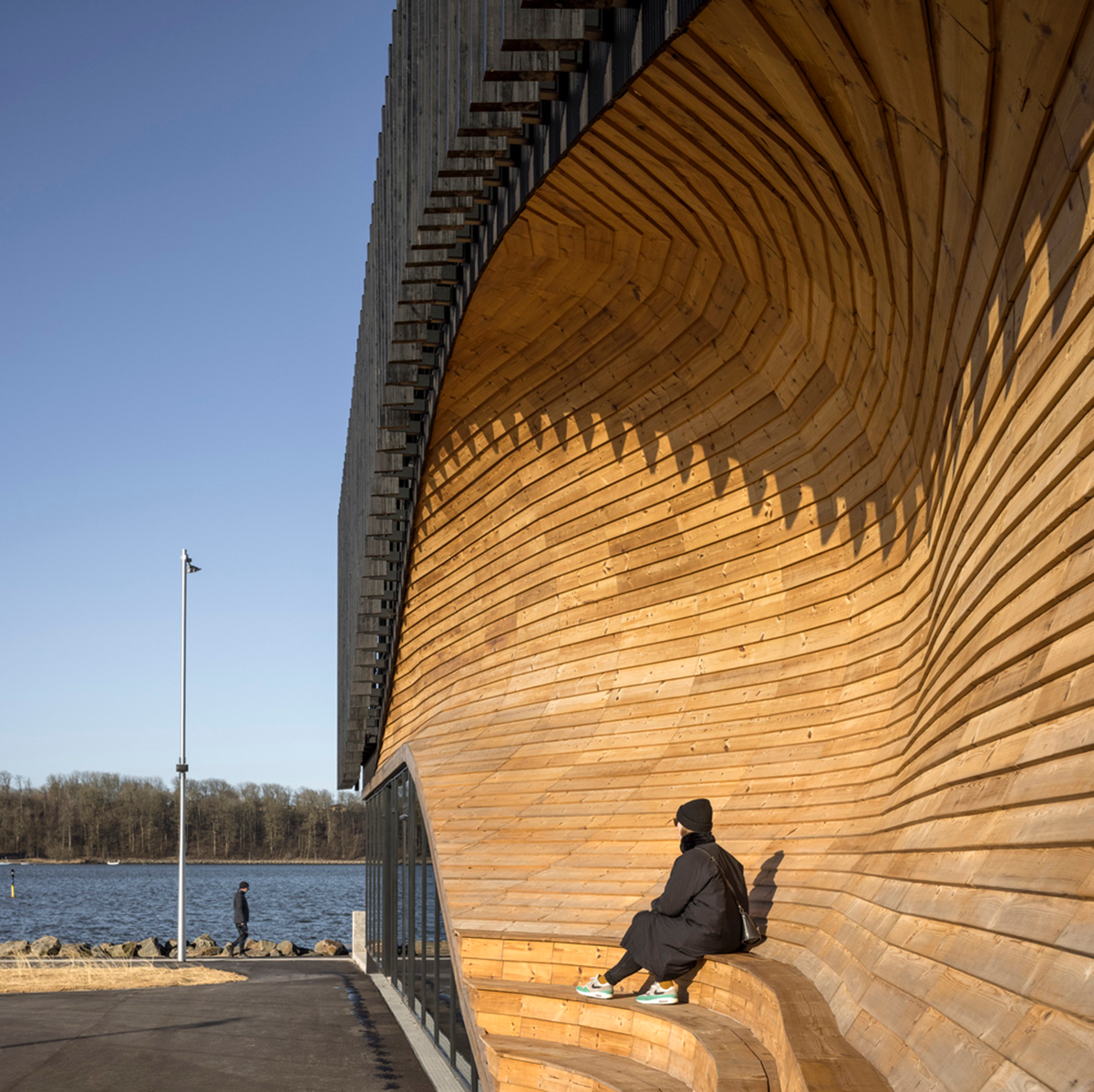 3XN Architects and SLA Architects complete Klimatorium featuring wooden wave in Denmark