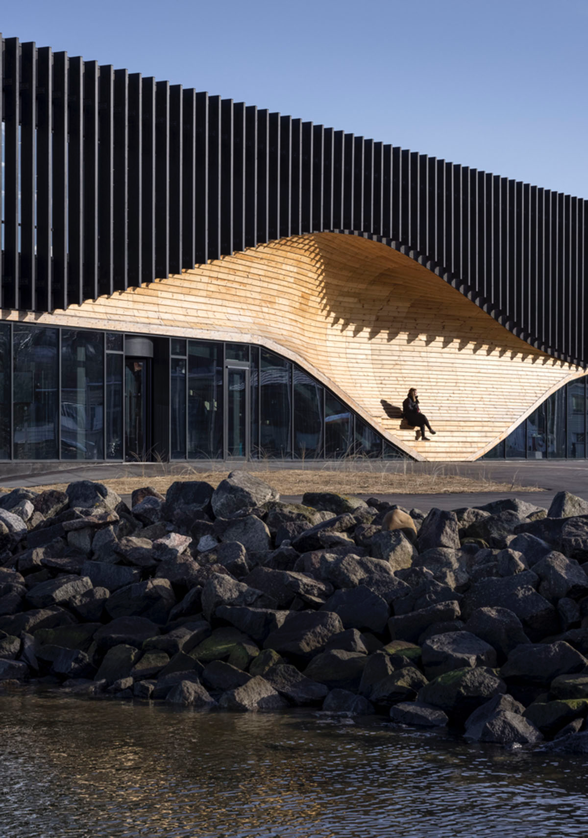 3XN Architects and SLA Architects complete Klimatorium featuring wooden wave in Denmark