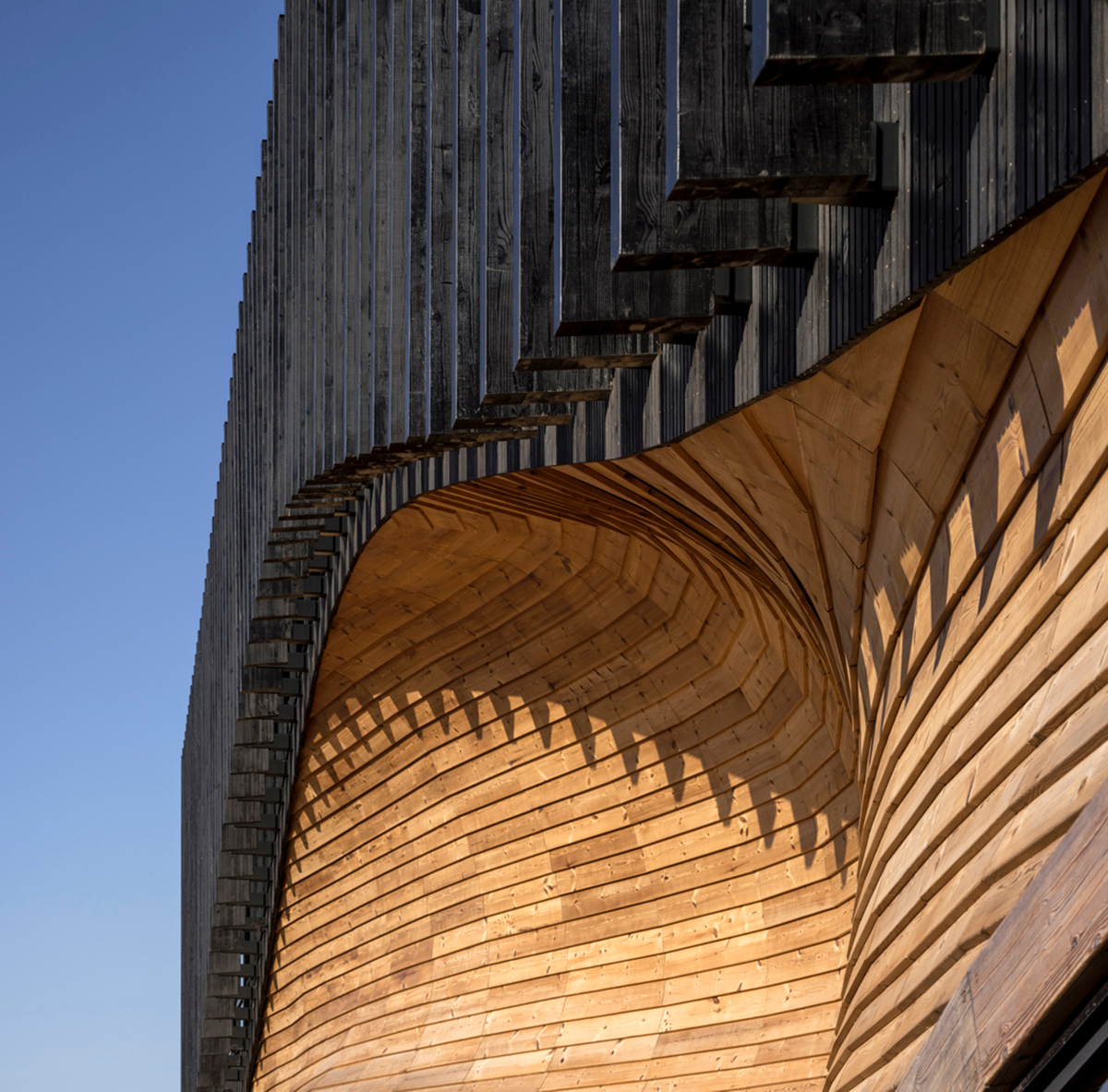3XN Architects and SLA Architects complete Klimatorium featuring wooden wave in Denmark