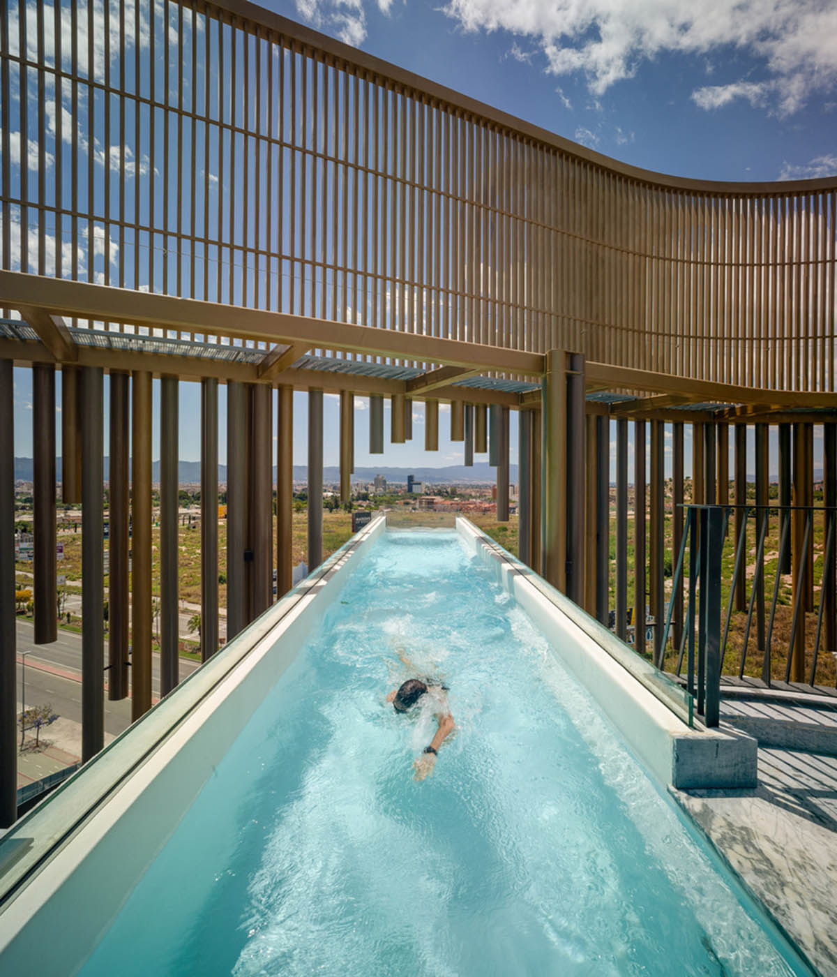 Leisure complex by Clavel Arquitectos features 22-metre cantilevered pool on each side in Spain