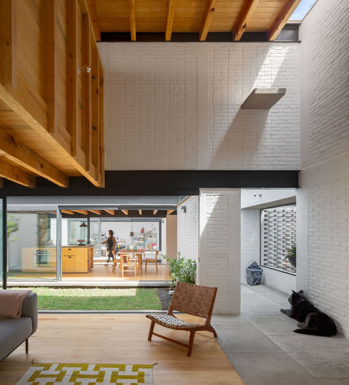 Sculptor's home studio features industrial saw-tooth roofs creating breathing interiors in Mexico