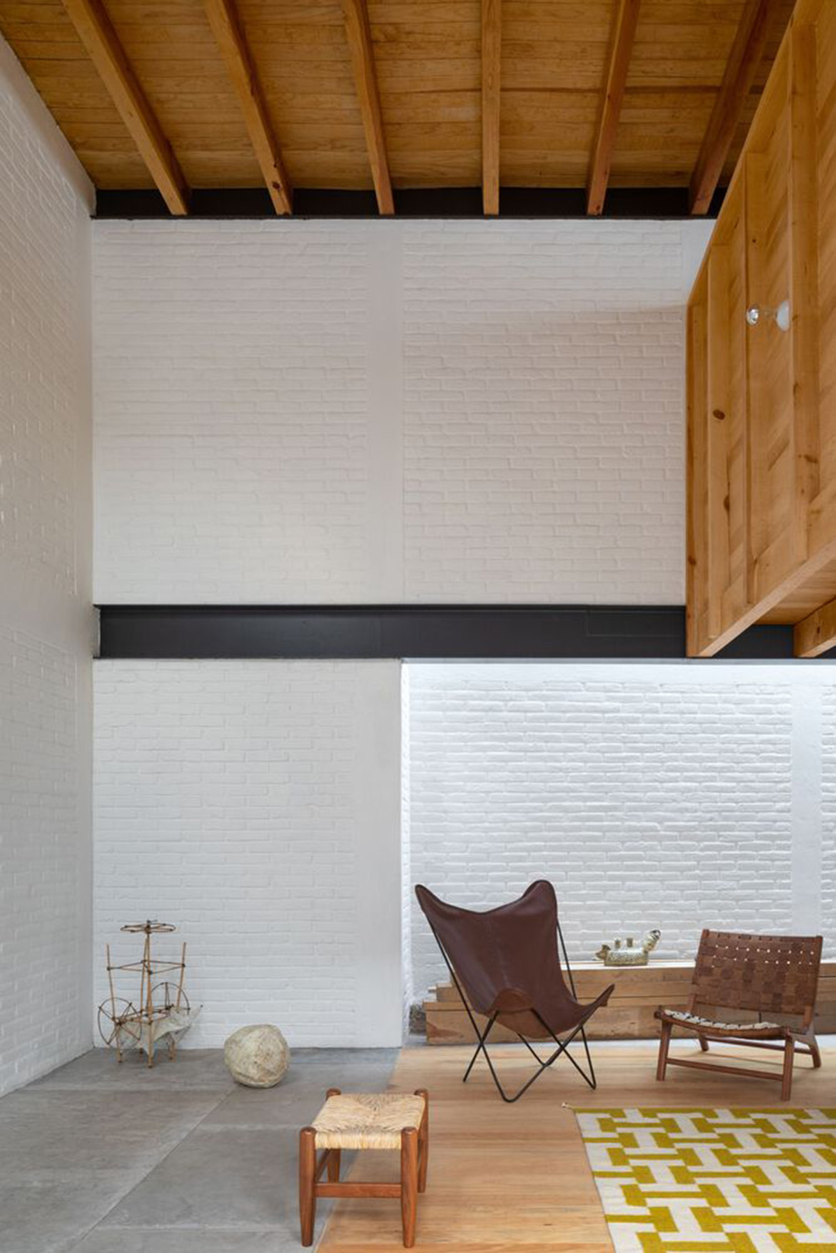 Sculptor's home studio features industrial saw-tooth roofs creating breathing interiors in Mexico