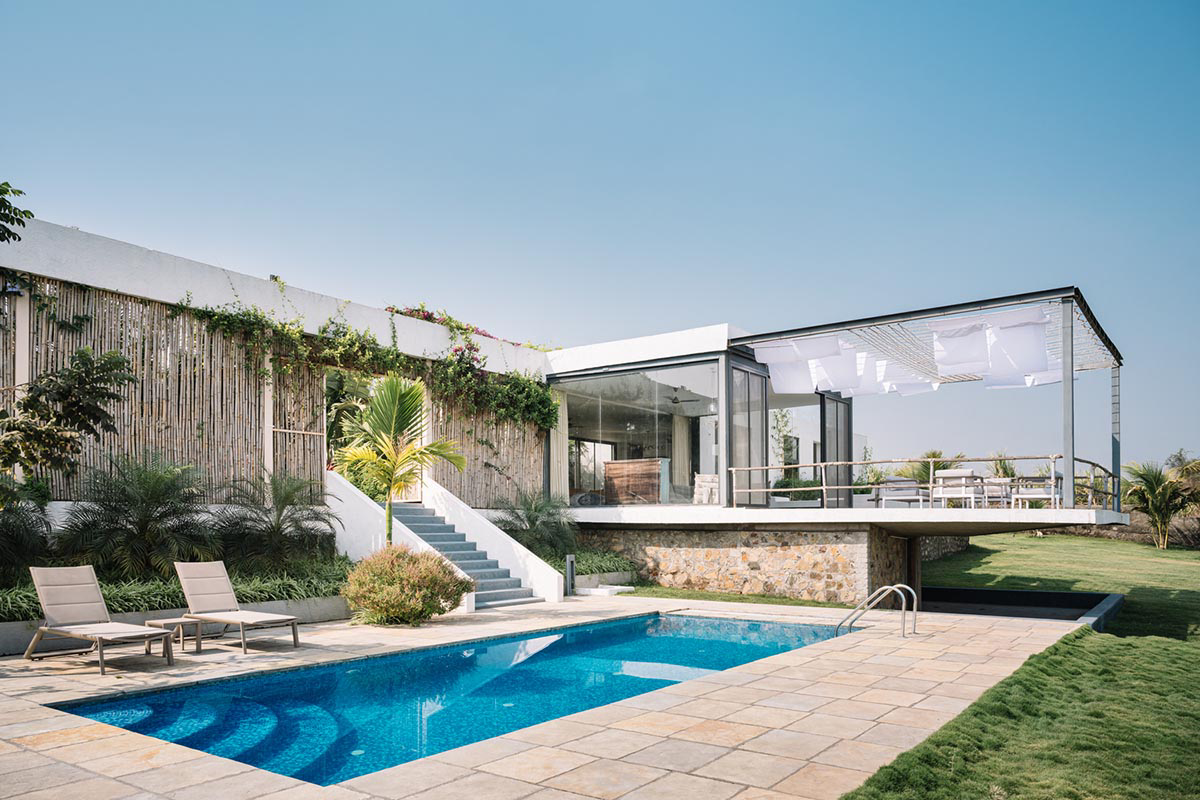 Weekend home is clad in bamboo screens that create a rustic appearance on the outskirts of Pune