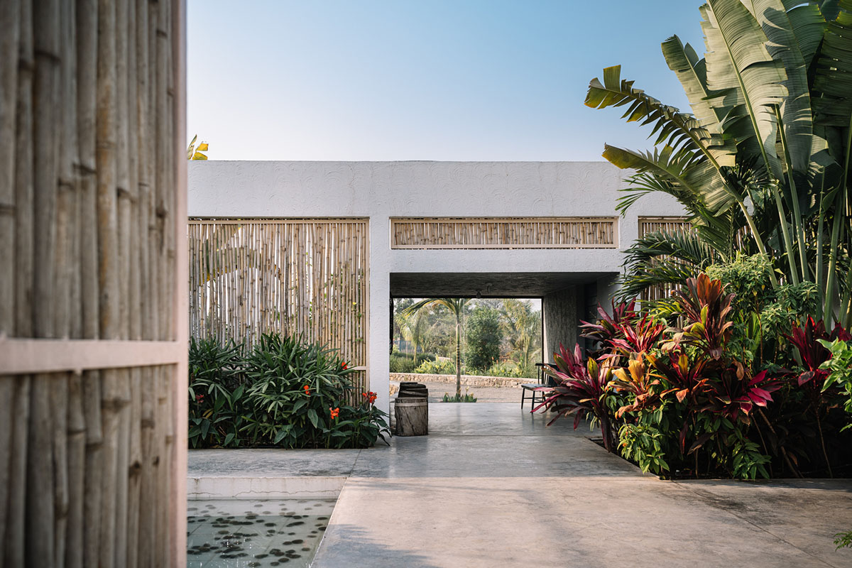 Weekend home is clad in bamboo screens that create a rustic appearance on the outskirts of Pune