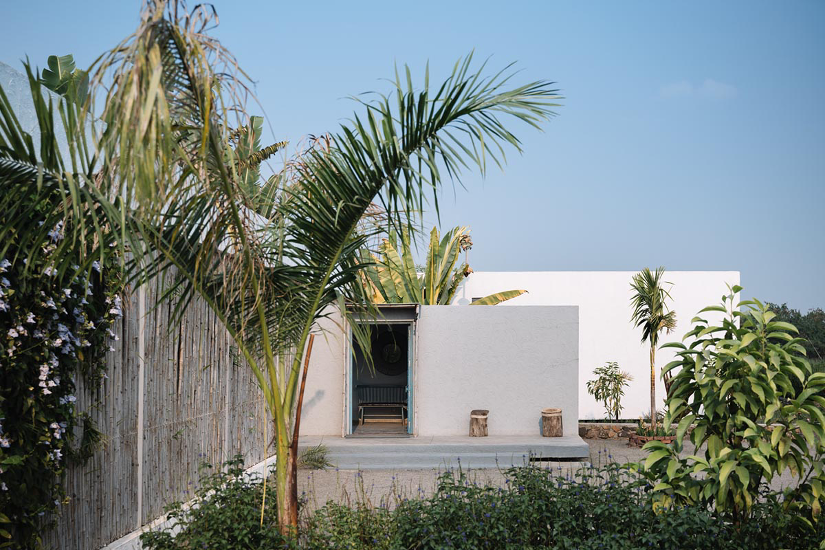 Weekend home is clad in bamboo screens that create a rustic appearance on the outskirts of Pune