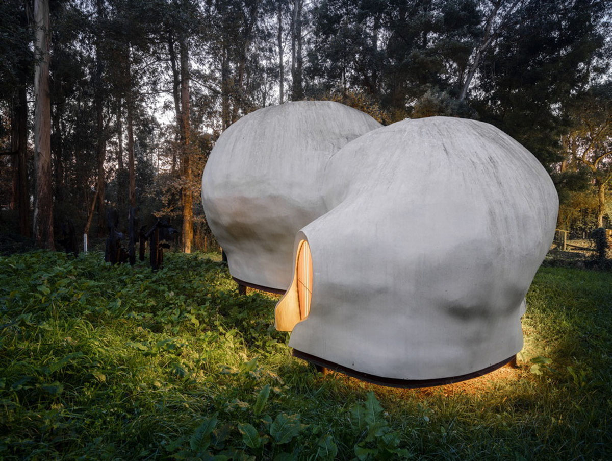 Super small cave-like art gallery by FCC Arquitectura built on lush green in Portugal