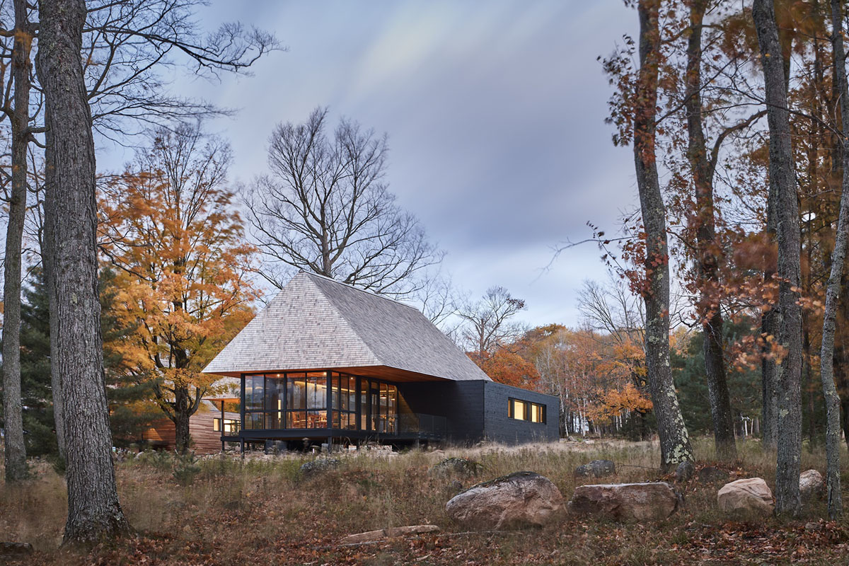 MacKay-Lyons Sweetapple Architects completes island cabins with extruded roofs among pine trees