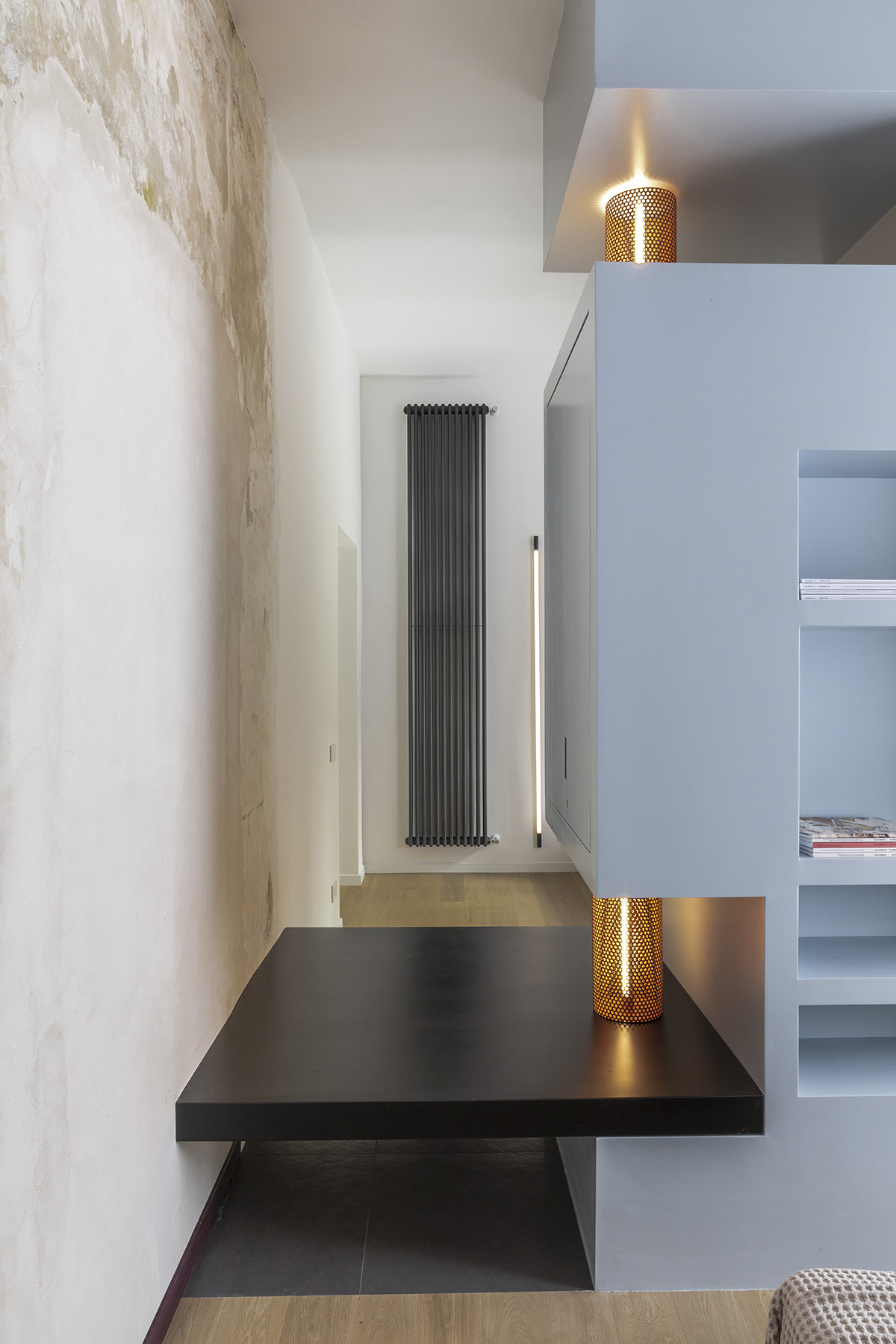 Totem House by STUDIOTAMAT is a rental home presenting cold shades and industrial looking in Rome 