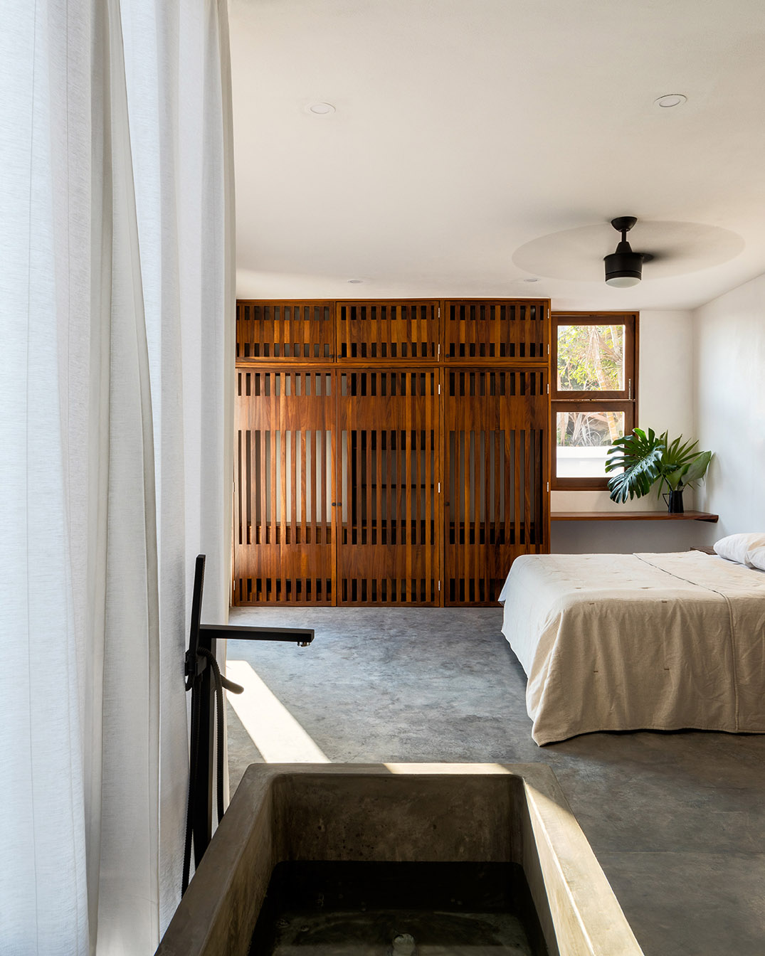 MAIN OFFICE's family house blends into the tropical landscape of a surfers' town in Mexico