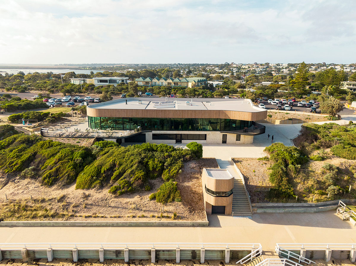 Wood Marsh completes surf club with timber rounded corners echoing ocean and eroded dunes
